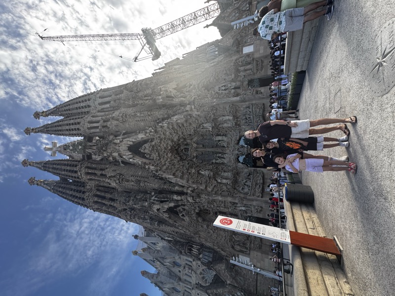 A family in front of the Sagrada Família in Barcelona